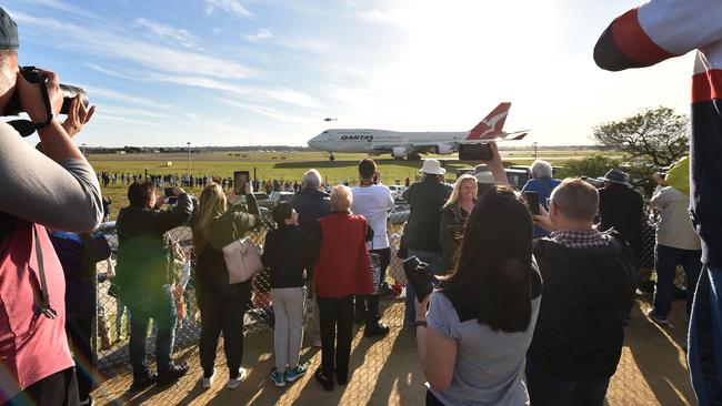 People watch as the last Qantas Boeing 747 airliner prepares to take off from Sydney airport to the US on July 22. Picture: (AFP)