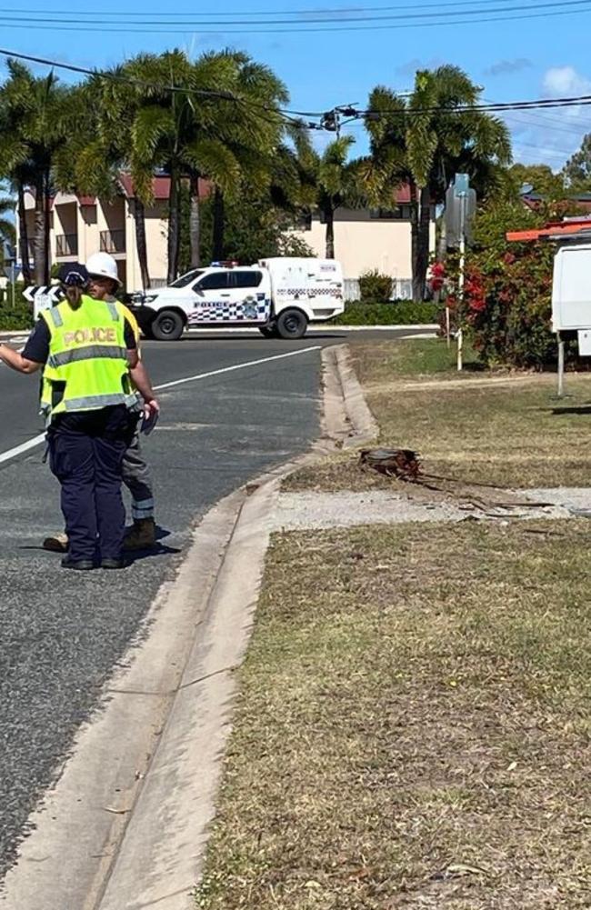 The car left the road and promptly collided with the power line, uprooting it and carrying it into a front yard. Photo: Lesley Yasso