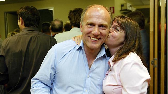 Eric Abetz gets a kiss from his wife Michelle at his office in Hobart