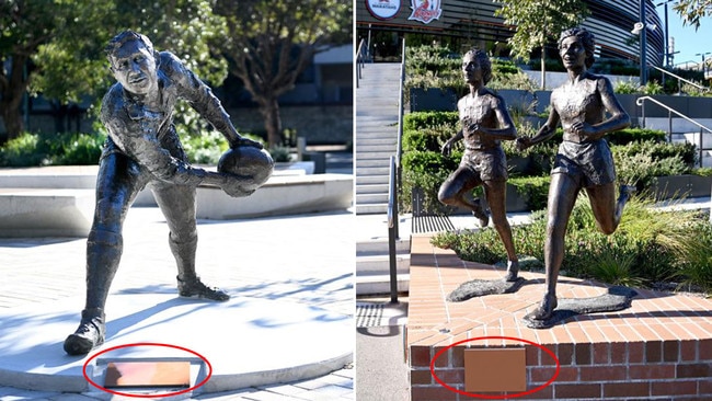 Statues of rugby great Ken Catchpole, left, and Olympic sprinters Betty Cuthbert and Marlene Mathews, right, covered up on FIFA's orders. Pictures: Jeremy Piper