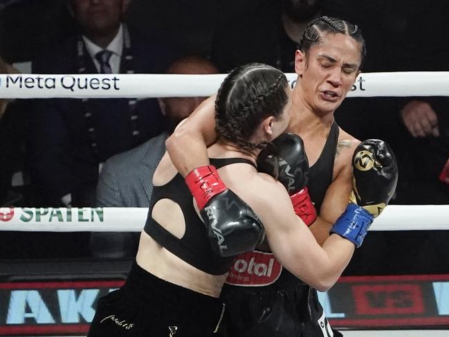 Puerto Rican boxer Amanda Serrano (R) and Irish boxer Katie Taylor (L) fight during their super-lightweight world championship boxing bout at The Pavilion at AT&T Stadium in Arlington, Texas, November 15, 2024. (Photo by TIMOTHY A. CLARY / AFP) / ALTERNATE CROP