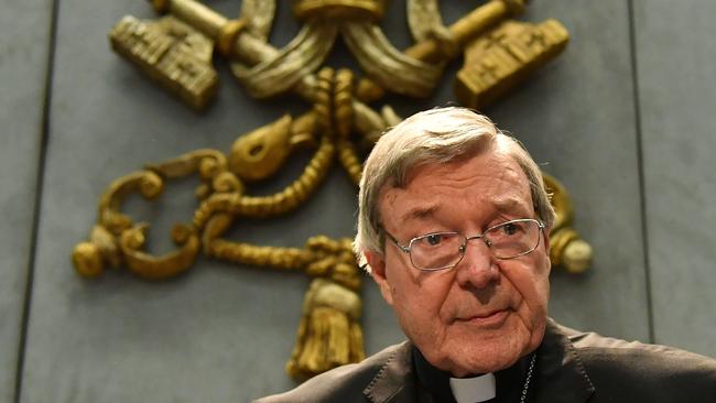 Cardinal George Pell makes a statement after the charges were laid. Picture: AFP/Alberto Pizzoli