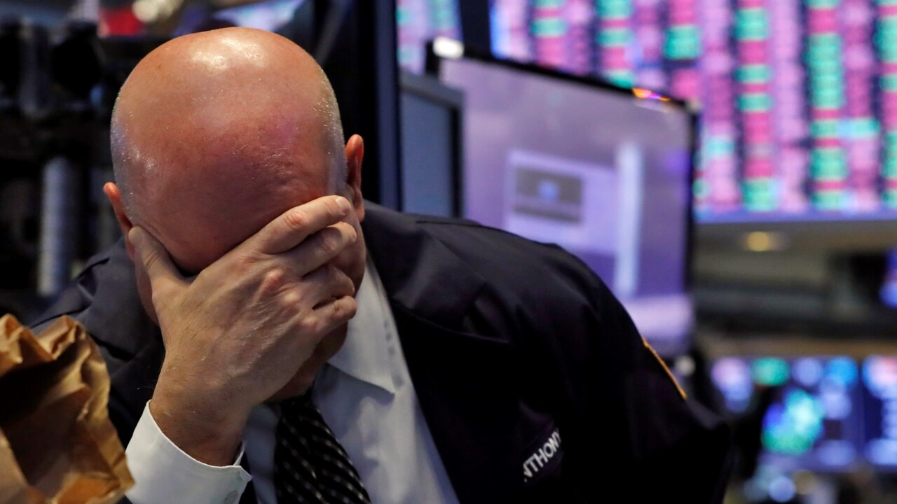 Wall St halts trading for third time in a week as market plunge continues