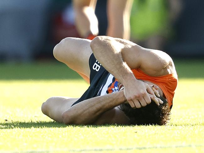 Giants Stephen Coniglio injured in tackle by St Kilda's Mitch Owens during the AFL match between the GWS Giants and St.Kilda Saints at Manuka Oval, Canberra on April 12, 2024. Photo by Phil Hillyard(Image Supplied for Editorial Use only - **NO ON SALES** - Â©Phil Hillyard )