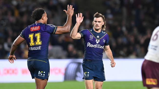 Ryan Papenhuyzen and Felise Kaufusi celebrate more success for the Storm. Picture: Bradley Kanaris / Getty Images