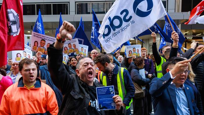 Essential workers from across NSW during a rally outside 52 Martin Place, today, to oppose the government's proposed cuts to workers compensation. Picture: Justin Lloyd.