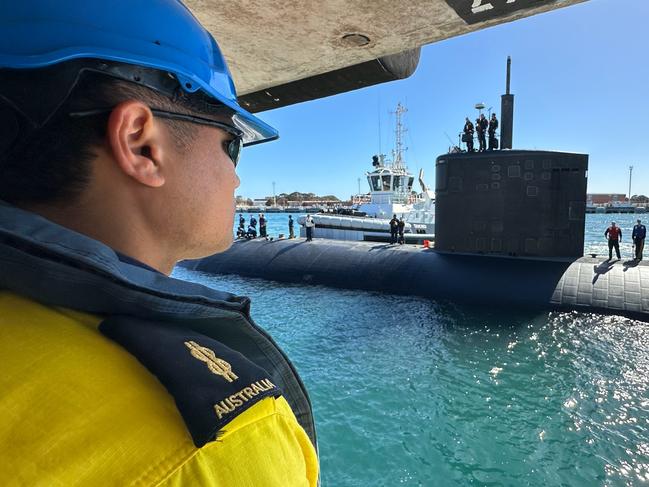 ROCKINGHAM, Western Australia (March 10, 2024) – U.S. Navy Sailors assigned to the Los Angeles-class fast-attack submarine USS Annapolis (SSN 760) and HMAS Stirling Port Services crewmembers prepare the submarine to moor alongside Diamantina Pier at Fleet Base West in Rockingham, Western Australia, March 10, 2024. The nuclear-powered, conventionally-armed submarine is in HMAS Stirling for the second visit by a fast-attack submarine to Australia since the announcement of the AUKUS (Australia, United Kingdom, United States) Optimal Pathway in March 2023. (U.S. Navy photo by Cmdr. Erik Wells)