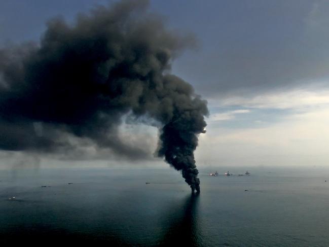 Smoke billows from controlled oil burns near the site of the BP Plc Deepwater Horizon oil spill in the Gulf of Mexico off the coast of Louisiana, U.S., on Saturday, June 19, 2010. The BP Plc oil spill, which began when the leased Transocean Deepwater Horizon oil rig exploded on April 20, is gushing as much as 60,000 barrels of oil a day into the Gulf of Mexico, the government said. Photographer: Derick E. Hingle/Bloomberg