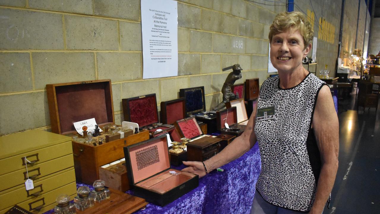 ANTIQUES: Vendor Jane Ford from Pomona displays antique medical, travel and personal boxes for sale. Photo: Stuart Fast