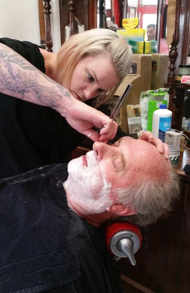 Michael Gudinski gets his beard chopped. Picture: Nui Te Koha