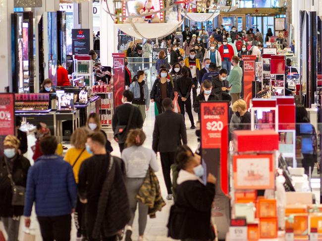 Customers shop at Macyâs department store in New York on Black Friday, November 27, 2020. - The coronavirus is clouding "Black Friday" much as it has overshadowed 2020 in general, but some leading experts still expect strong overall sales even as shopping patterns are altered. (Photo by Kena Betancur / AFP)