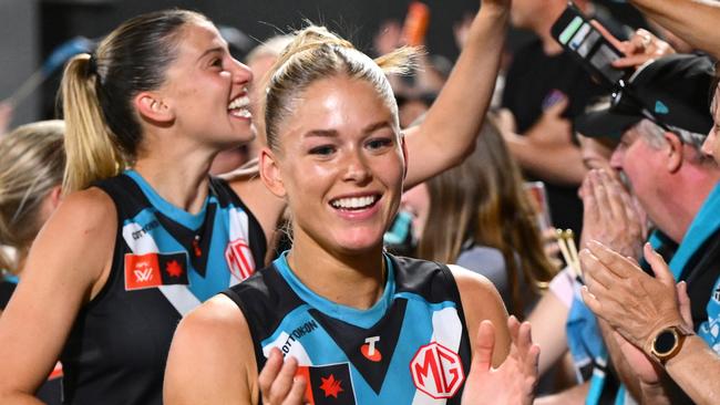 MELBOURNE, AUSTRALIA - NOVEMBER 16: Power players celebrate with fans after winning the AFLW Semi Final match between Hawthorn Hawks and Port Adelaide at Ikon Park, on November 16, 2024, in Melbourne, Australia. (Photo by Quinn Rooney/Getty Images)