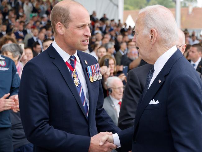 Prince William, the Prince of Wales (L) shakes hand with US President Joe Biden during the International commemorative ceremony at Omaha Beach. Picture: AFP