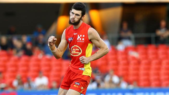 Jarrad Grant celebrates a goal for the Gold Coast Suns against North Melbourne at Metricon Stadium last year. He is returning to the MPNFL in 2018. Picture: Adam Head