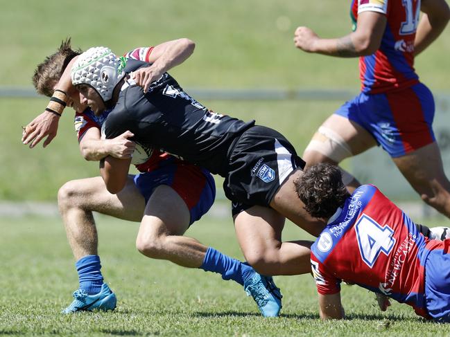 Ali Hicham Karnib is brought to ground by Toby Winter. Picture: Michael Gorton