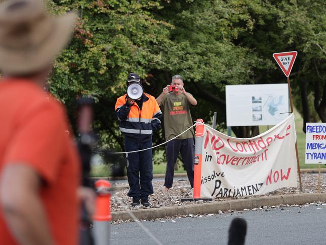 Protesters waited for the PM outside the gates of Government House. Picture: Toby Zerna