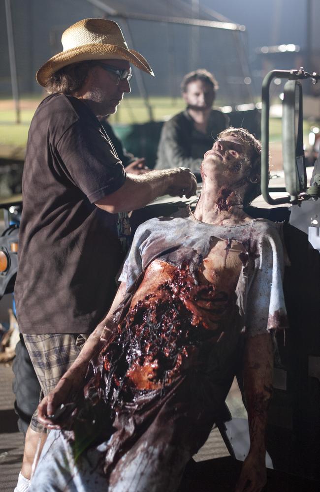 The magic of make-up: Greg Nicotero works on a zombie. Picture: Gene Page/AMC