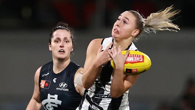 Collingwood’s Eliza James takes a mark at IKON Park. Picture: Michael Klein