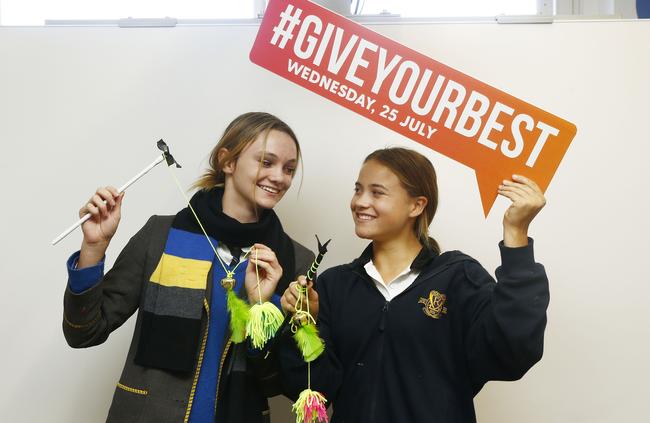 Kambala School students Sunny Salt and Lara Finlayson are ensuring the shelter animals are kept amused. Picture: John Appleyard