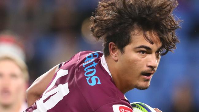 GOLD COAST, AUSTRALIA - AUGUST 21: Jordan Petaia of the Reds is tackled during the round eight Super Rugby AU match between the Western Force and the Queensland Reds at Cbus Super Stadium on August 21, 2020 in Gold Coast, Australia. (Photo by Chris Hyde/Getty Images)