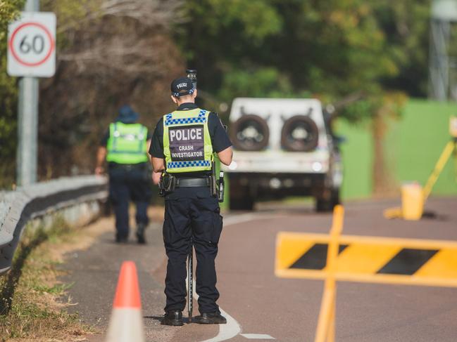 NT Police Crash Investigators at the scene of a car crash on Dick Ward Drive overnight with roads closed in both Directions.Picture GLENN CAMPBELL