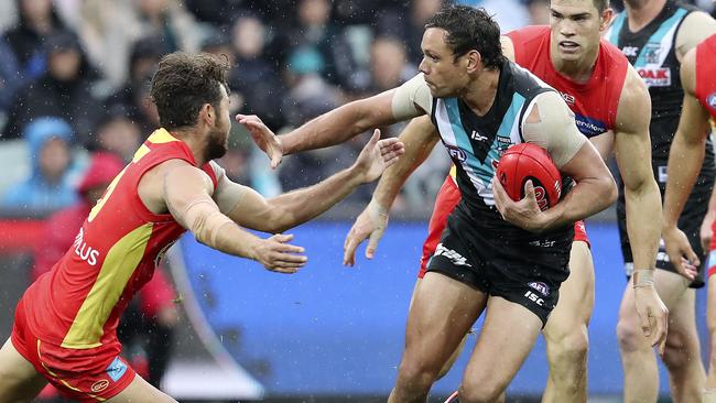 AFL - Port Adelaide v Gold Coast Suns at The Adelaide Oval. Steven Motlop delivers a don't argue to Jarrod Harbrow. Picture SARAH REED