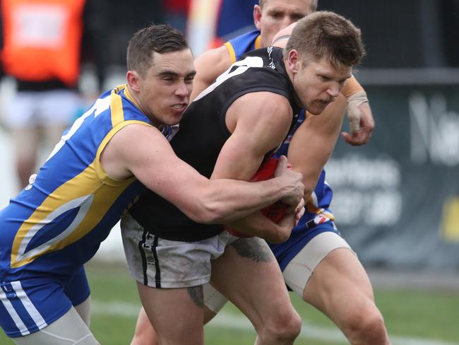 Jason Kennedy is caught in a tackle. Picture: David Crosling