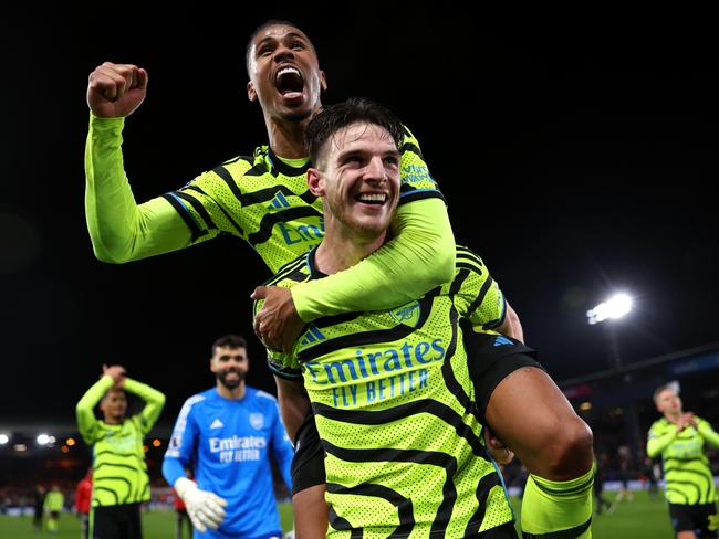 Declan Rice is mobbed by teammate Gabriel after his 97-minute strike sunk Luton Town in the Premier League. Picture: Julian Finney/Getty Images.