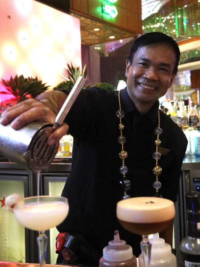 Pullman Reef Casino bar supervisor Eddie Valdez prepares festive cocktails ahead of the venues New Year’s Eve celebrations on Tuesday night. Photo: Catherine Duffy.