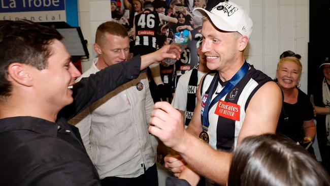 Frampton celebrating in the rooms with friends after the match. Picture: Getty Images