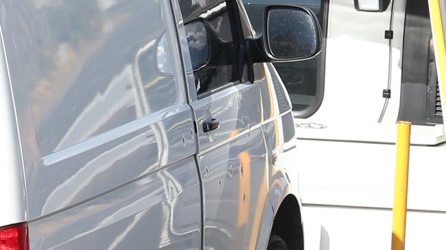 Several gunshot holes can be seen in the driver’s door after the shocking EastLink shooting. Picture: David Crosling