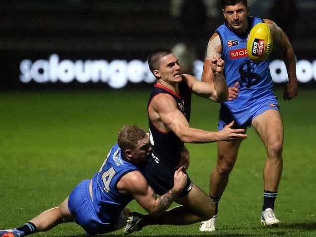 Nick Lowden (centre) playing for the Redlegs. Picture: Supplied