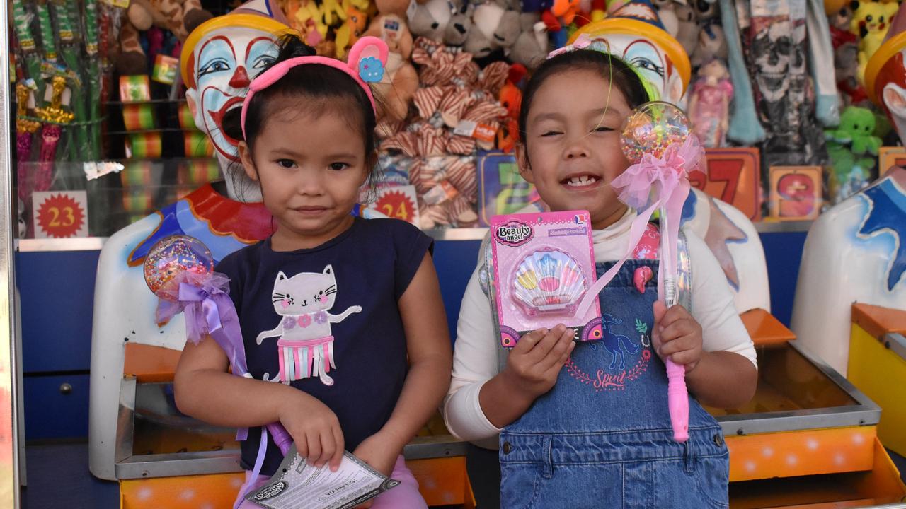 Michelle Coenders and Maria Jones of Proserpine with their prizes from the Clowns game at the Bowen Show. Picture: Kirra Grimes