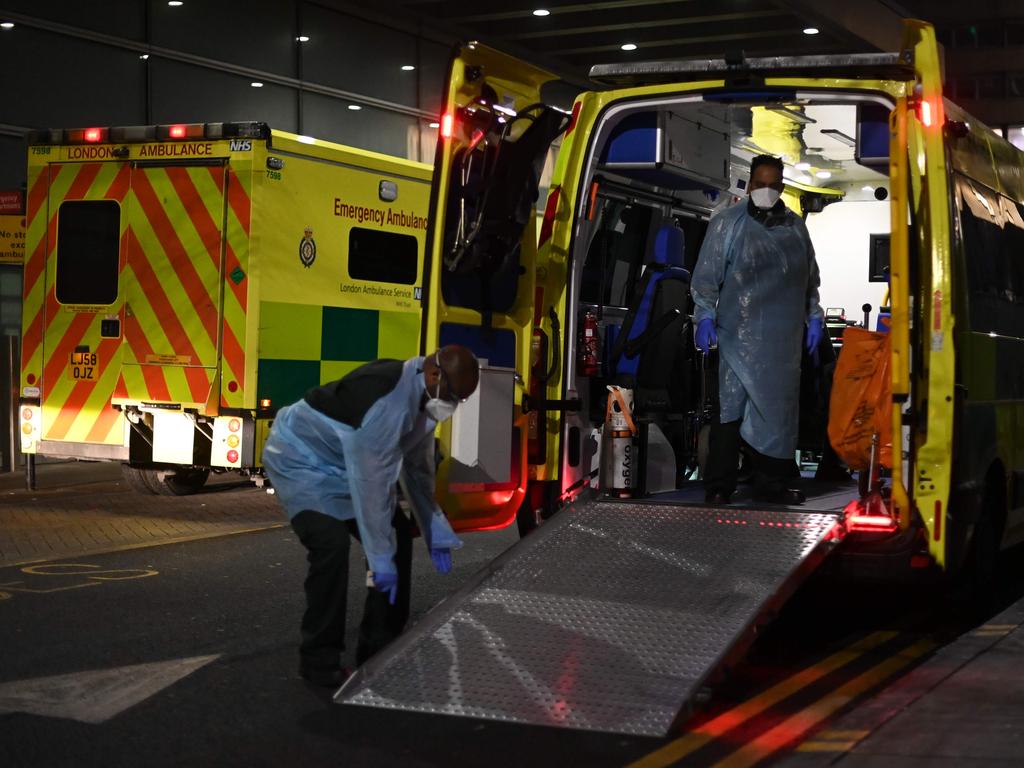 Paramedics wearing PPE outside the Royal London hospital in London on Sunday as surging cases of the coronavirus place health services under increasing pressure. Picture: Daniel Leal-Olivas