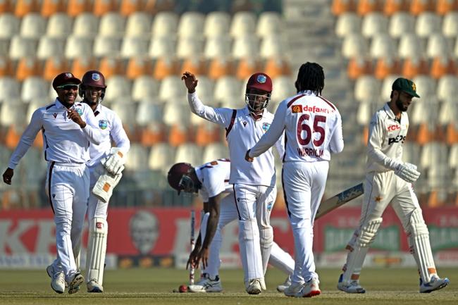 West Indies' players celebrate the dismissal of Pakistan's Kashif Ali