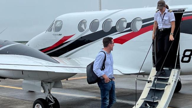 Wealthcheck boss Sam Mitchell being welcomed aboard a flight while still operating his business.