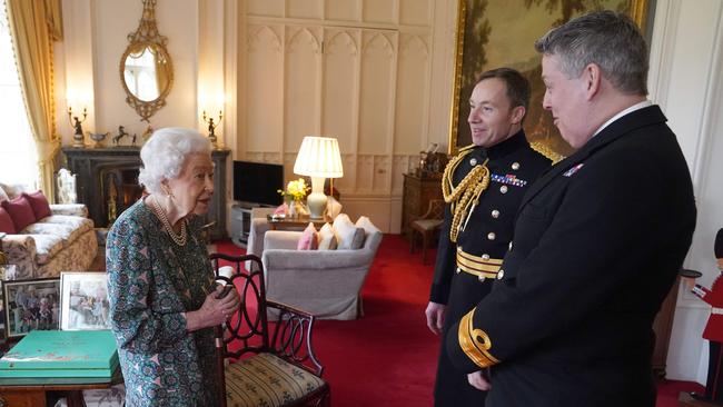 The Queen with outgoing Defence Service secretary Rear Admiral James Macleod, far right, and incoming Defence Service secretary Major General Eldon Millar at Windsor Castle on Wednesday. Picture: AFP