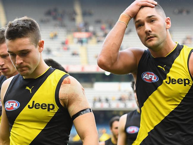 MELBOURNE, AUSTRALIA - MAY 14:  Jayden Short and Shaun Grigg of the Tigers looks dejected after losing the round eight AFL match between the Richmond Tigers and the Fremantle Dockers at Melbourne Cricket Ground on May 14, 2017 in Melbourne, Australia.  (Photo by Quinn Rooney/Getty Images)