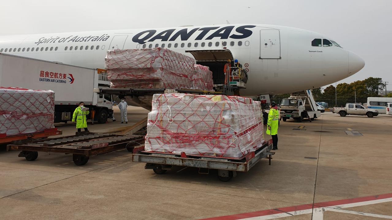 A Qantas A330 being loaded with freight.