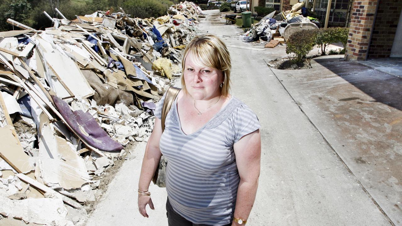 Lauren Way stands in the driveway of the Mi-Hi Grove town houses where she bought her home. Photo: Claudia Baxter / The Queensland Times