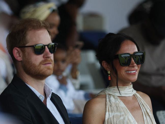 Britain's Prince Harry (L), Duke of Sussex, and Britain's Meghan (R), Duchess of Sussex, attend a charity polo game at the Ikoyi Polo Club in Lagos on May 12, 2024 as they visit Nigeria as part of celebrations of Invictus Games anniversary. (Photo by Kola Sulaimon / AFP)