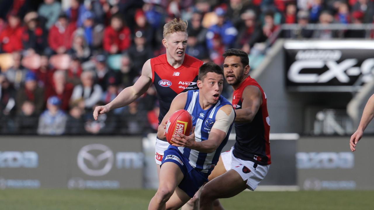 Nathan Hrovat evades a tackle during his playing career at North Melbourne. Picture: LUKE BOWDEN