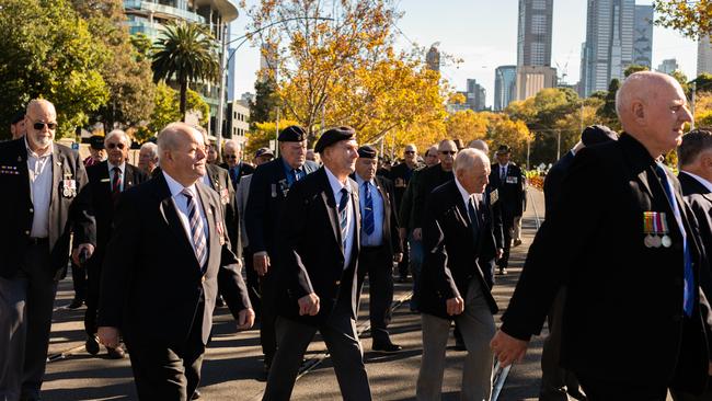 Anzac Day marchers walk in a procession on St Kilda Rd. Picture: Asanka Ratnayake/Getty Images