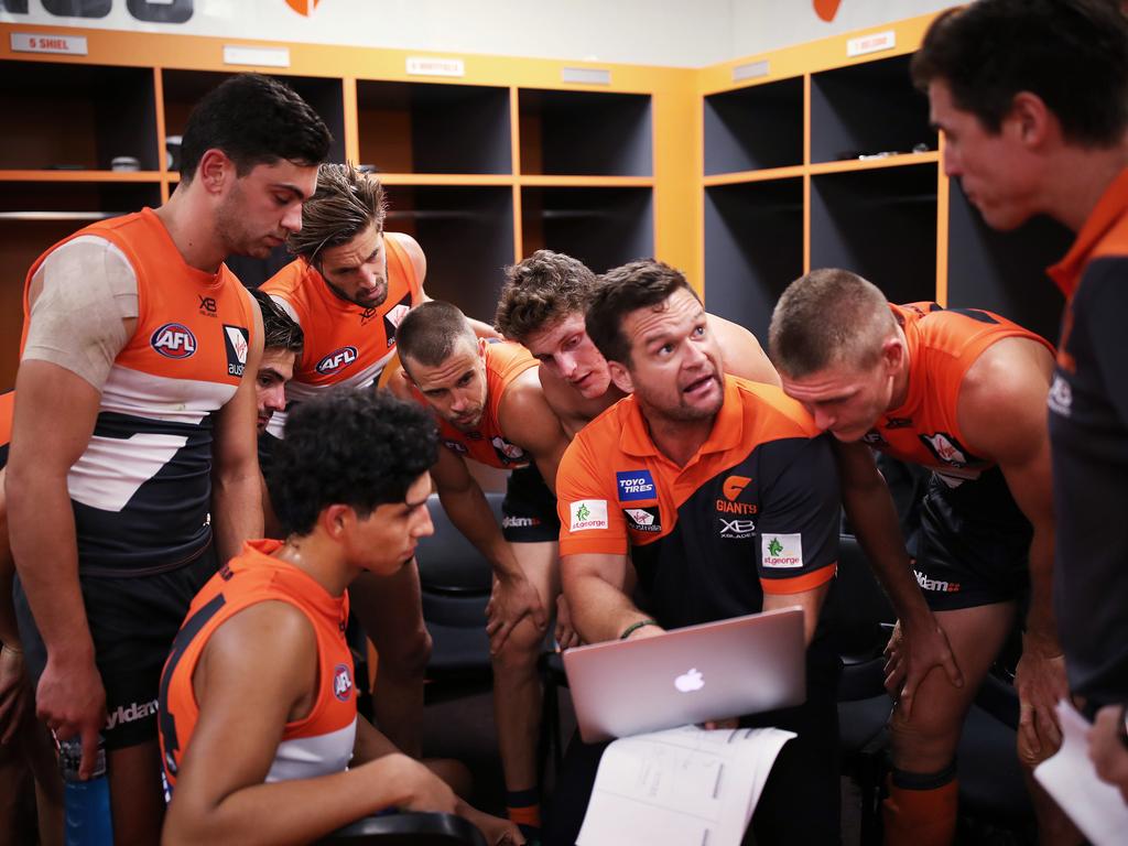 Half time and midfielders come together in a group to review the first half going through some vision with assistant Amon Buchanan. Picture: Phil Hillyard