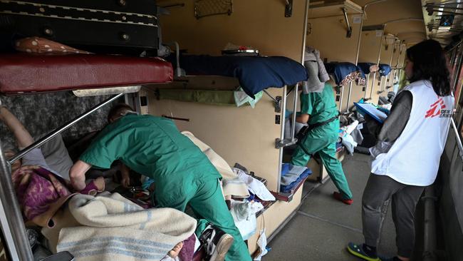 A Doctors Without Borders’ team care for patients on a medical evacuation train on its way to the western Ukrainian city of Lviv.