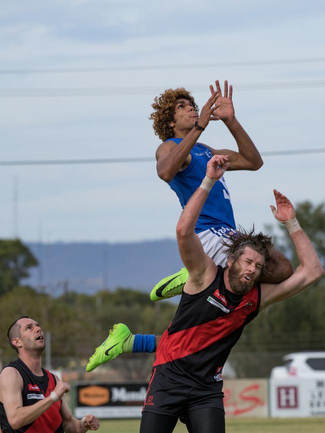 Solomontown’s Jeremiah Scrutton soars over Central Augusta ruckman Clayton Crabb in the Spencer Gulf Football League. Picture: Ethan Nitz Photography