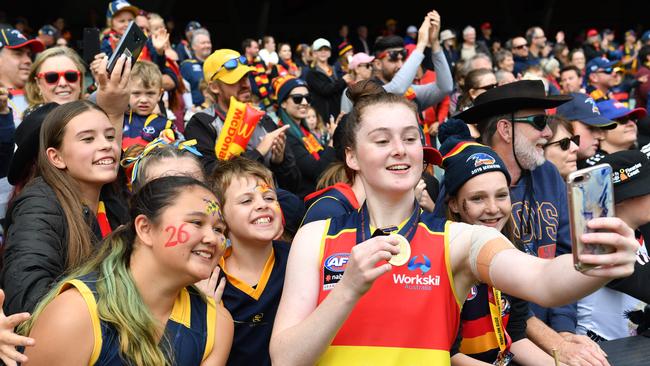 Crows AFLW defender Sarah Allan, pictured with fans after Adelaide won the 2019 grand final, was named in this year’s All-Australian team. Picture: AAP/ Keryn Stevens