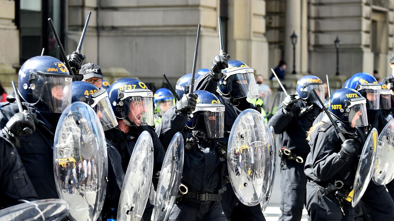 The rioters have targeted mosques and hotels housing asylum seekers, forcing the government to provide emergency security to Islamic places of worship. (Photo by PETER POWELL / AFP)