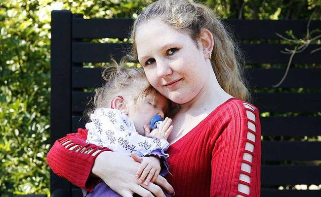 Christine Priestley holds her 22-month-old daughter, Adele Elliott, who suffers from a rare genetic condition. Picture: Claudia Baxter