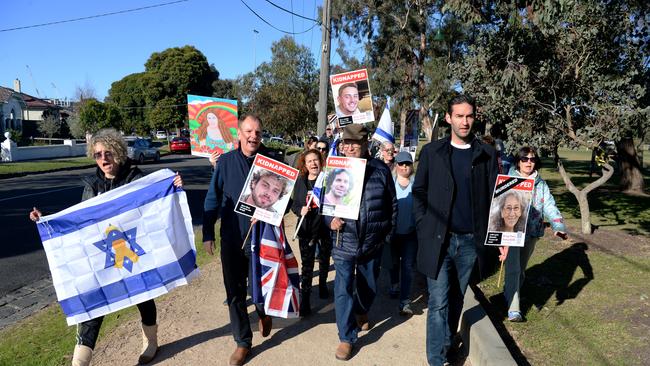 The group, including federal Labor MP Josh Burns (right), marched around Caulfield Park in support of Israelis still being held hostage in the occupied Palestinian Territories. Picture: NewsWire / Andrew Henshaw